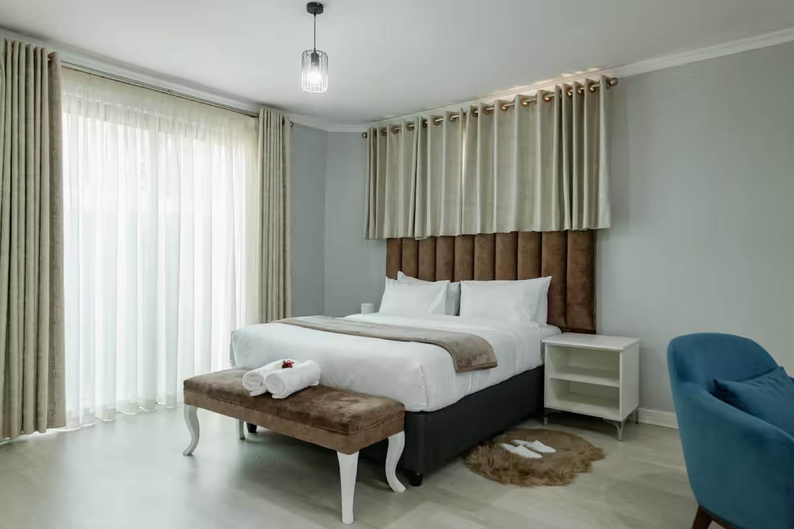 Studio Four — fresh towels laid out at the foot of the bed